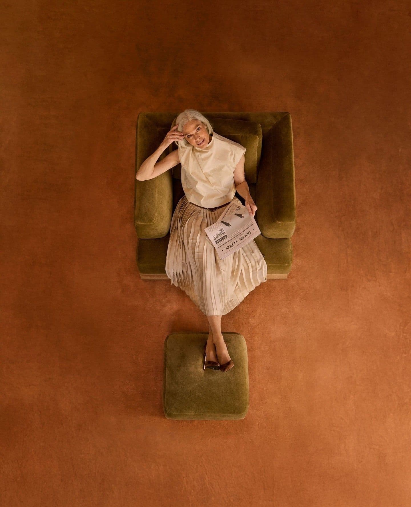Woman relaxing in a stylish chair